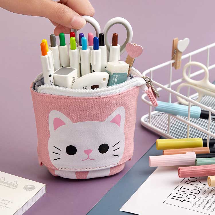 Pens and stationery being organized inside of a Cute Pink Cat Sliding Pencil Case. Made by PushCases